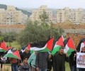 مئات الفلسطينيين يتظاهرون تنديداً بقانون القومية العنصري